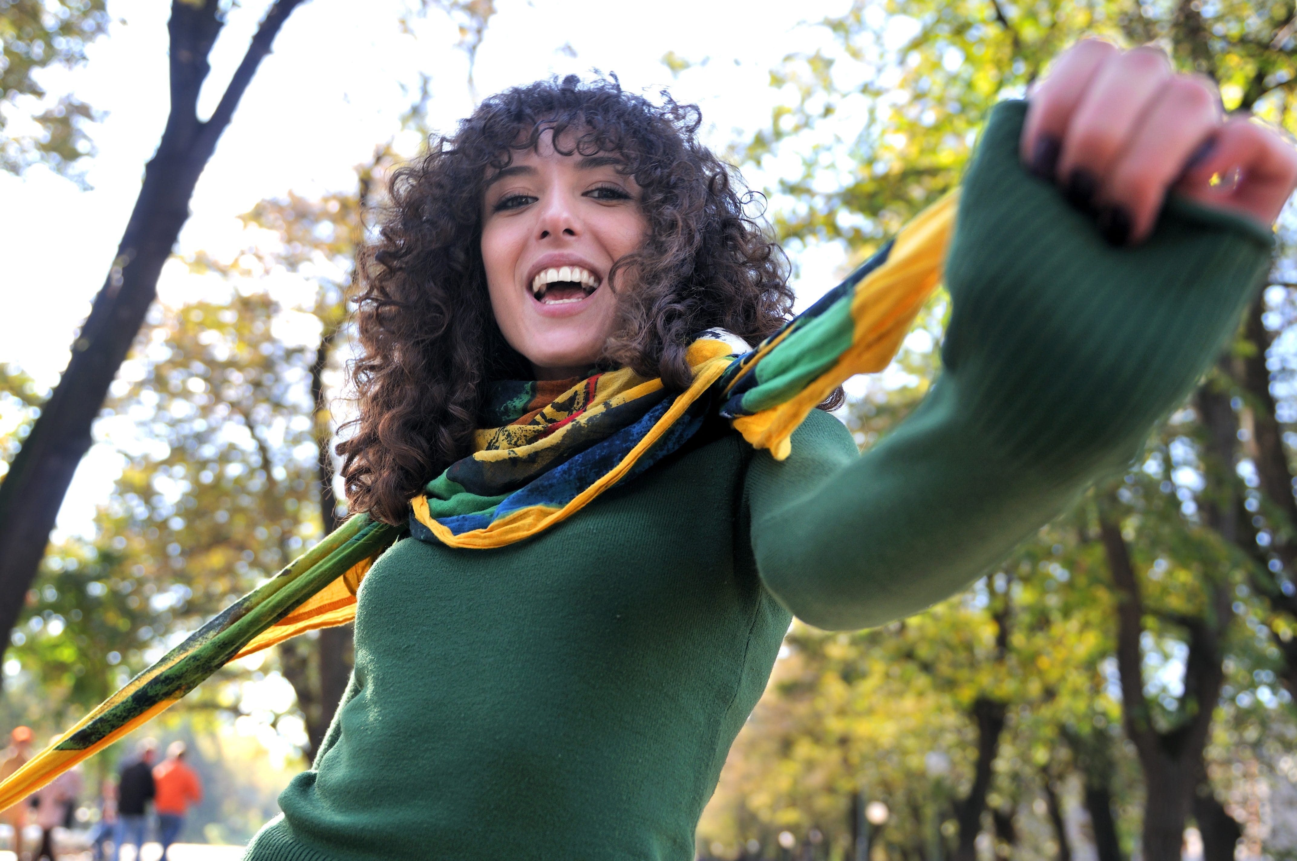 Young curly woman smiling