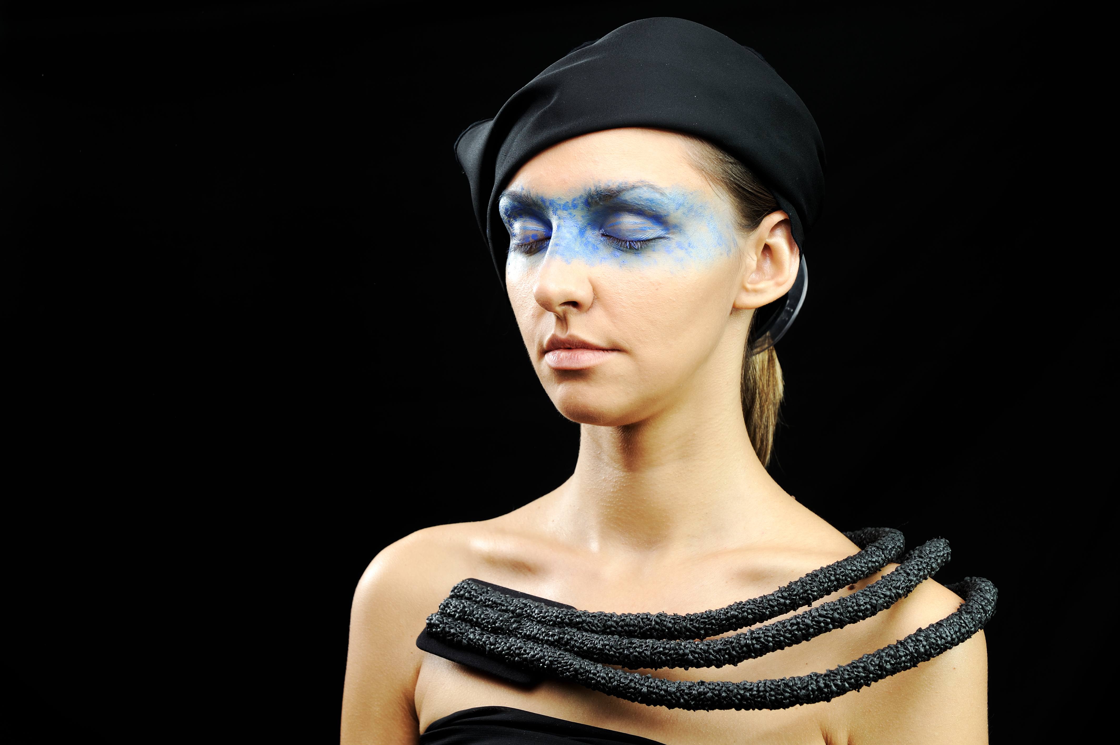 Very pretty woman with dark scarf, necklace, dress and colorful mask eyes, fashion stylish model